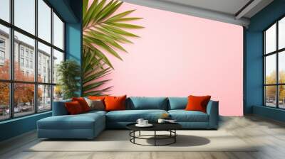 Green palm tree fronds, isolated on the left on a pastel pink background for copy space. wide 16:9 Wall mural