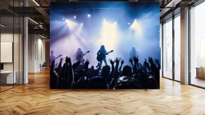 A concert scene stage lights. Rock show. People crowded silhouettes. Wall mural