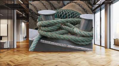 Ship bollard with ropes to which boat is moored Wall mural