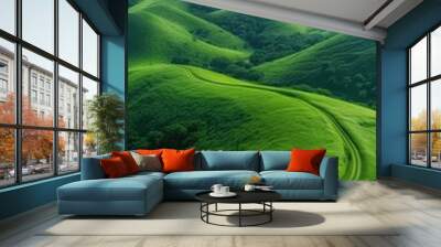 winding road through lush green hills under a vibrant cloudy sky, green landscape background concept creative layer Wall mural