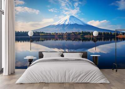 A majestic Mount Fuji stands tall, its peak reflected in the still waters below. Trees line the tranquil lake, their own reflections adding to the peaceful scene. Wall mural