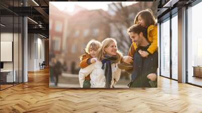 Affectionate young family enjoying their day in a city Wall mural