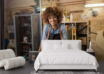 Afro american woman craftswoman working in her workshop

 Wall mural