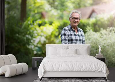 Elderly man mowing the lawn Wall mural