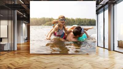 Father and kids having fun in the lake
 Wall mural