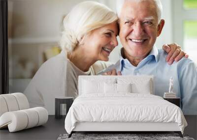 Happy senior couple at home Wall mural