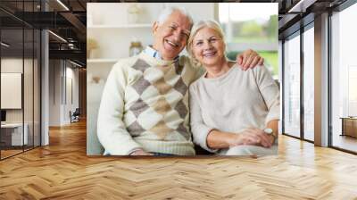 Happy senior couple at home Wall mural