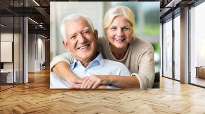 Happy senior couple at home Wall mural