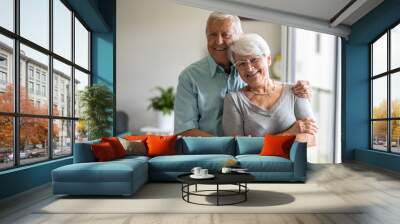 Happy senior couple at home
 Wall mural