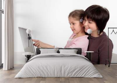 mother and daughter using laptop Wall mural