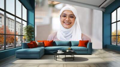 Portrait of a confident muslim businesswoman in an office building
 Wall mural