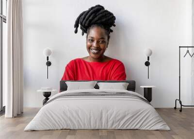 Portrait of a smiling young woman indoors
 Wall mural