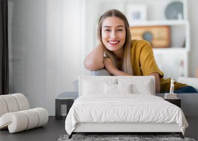 Portrait of a woman relaxing at home  Wall mural