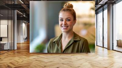 Portrait of an young businesswoman in a modern office 
 Wall mural