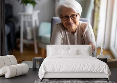 Portrait of smiling senior woman at home
 Wall mural