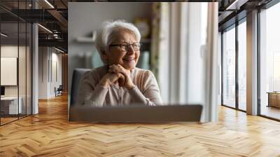 Portrait of smiling senior woman at home
 Wall mural