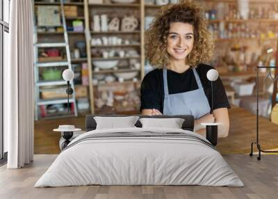 Portrait of woman pottery artist in art studio Wall mural