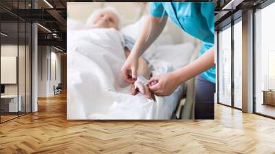 Senior patient and nurse in hospital Wall mural