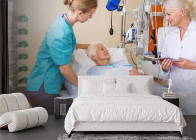 Senior patient in hospital bed Wall mural