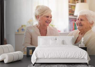 Senior woman spending quality time with her daughter Wall mural