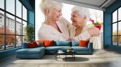 Senior woman spending quality time with her daughter Wall mural