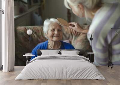 Woman combing hair of elderly mother 
 Wall mural