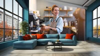 Woman working in coffee shop Wall mural