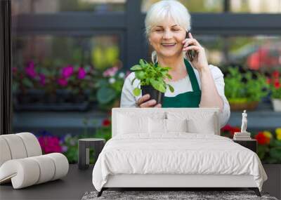 Woman working in florist shop
 Wall mural