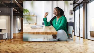 Young adult female professional working in a modern office
 Wall mural