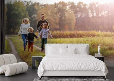 Young family having fun outdoors
 Wall mural