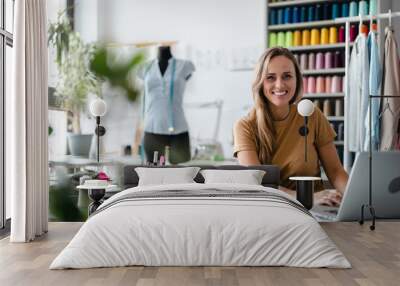 Young fashion designer at her workplace
 Wall mural