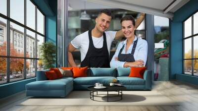 Young man and woman working at cafe
 Wall mural