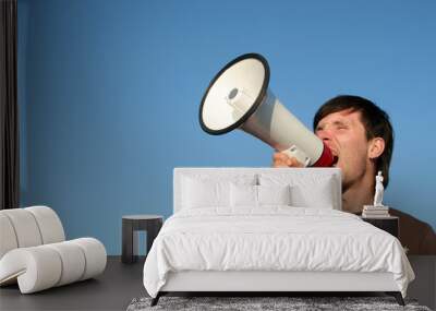 young man shouting through megaphone Wall mural