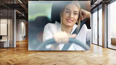 Young woman sitting in a car 
 Wall mural