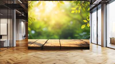 Autumn leaves on the wooden background. Beautiful spring background with green juicy young foliage and empty wooden table in nature Wall mural