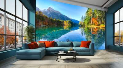 Beautiful autumn sunrise scene with trees near turquoise water of Hintersee lake Wall mural