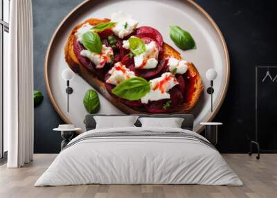 Beet bruschetta with goat cheese and basil on the plate close up Wall mural