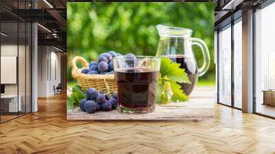 Grape juice in the glass and pitcher  Wall mural