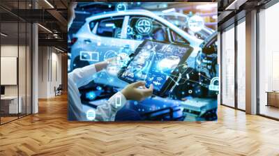 Industry engineer in factory using smart tablet device to control networking for auto industry. Smart industry 4.0 technology concept Wall mural