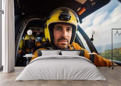 Portrait of a rescuer man inside the rescue helicopter Wall mural