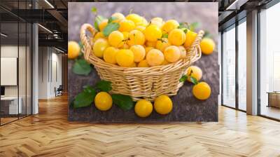 Yellow plums in the basket Wall mural