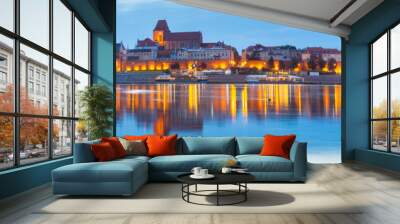 Torun. City embankment along the river at sunset. Wall mural