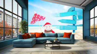 wooden billboard and Christmas decoration on sand beach, image for Christmas holiday vacation concept. Wall mural