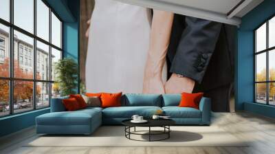 bride and groom holding hands Wall mural