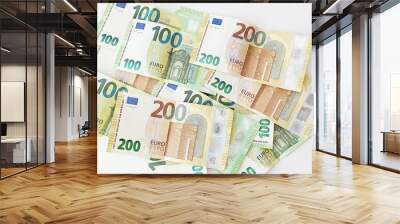 Crypto currency concept - A bitcoin with euro bills, 100 euro and 200 euro banknotes Wall mural