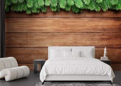 green branches of a fir tree on wooden planks background, christmas frame with copy space Wall mural