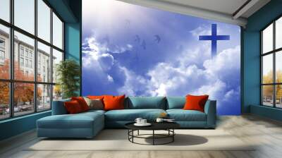 Christian cross appeared bright in the sky with soft fluffy clouds, white, beautiful colors. With the light shining as hope, love and freedom in the sky background Wall mural