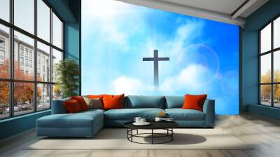 Christian cross appeared bright in the sky with soft fluffy clouds, white, beautiful colors. With the light shining as hope, love and freedom in the sky background Wall mural