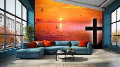 Christmas concept: the symbol of the cross of Jesus Christ on earth The back with a soft glow of sunset And birds that fly like freedom, like love, sacrifice, beautiful mercy Wall mural