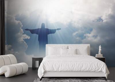 Jesus appeared bright in the sky and Christian Cross with soft fluffy clouds, white and beautiful with the light shining as hope, love and freedom in the sky background. Wall mural